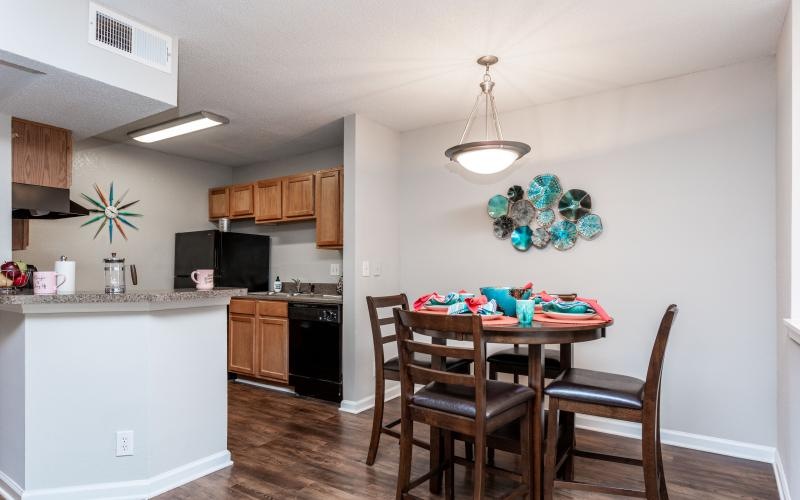 a kitchen with a dining table and chairs